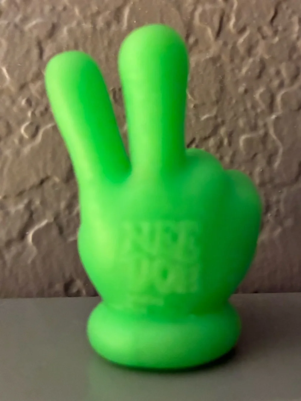 Mini individual “Teenie” NeeDoh Neon Green Peace sign Hand silicone figure. New.